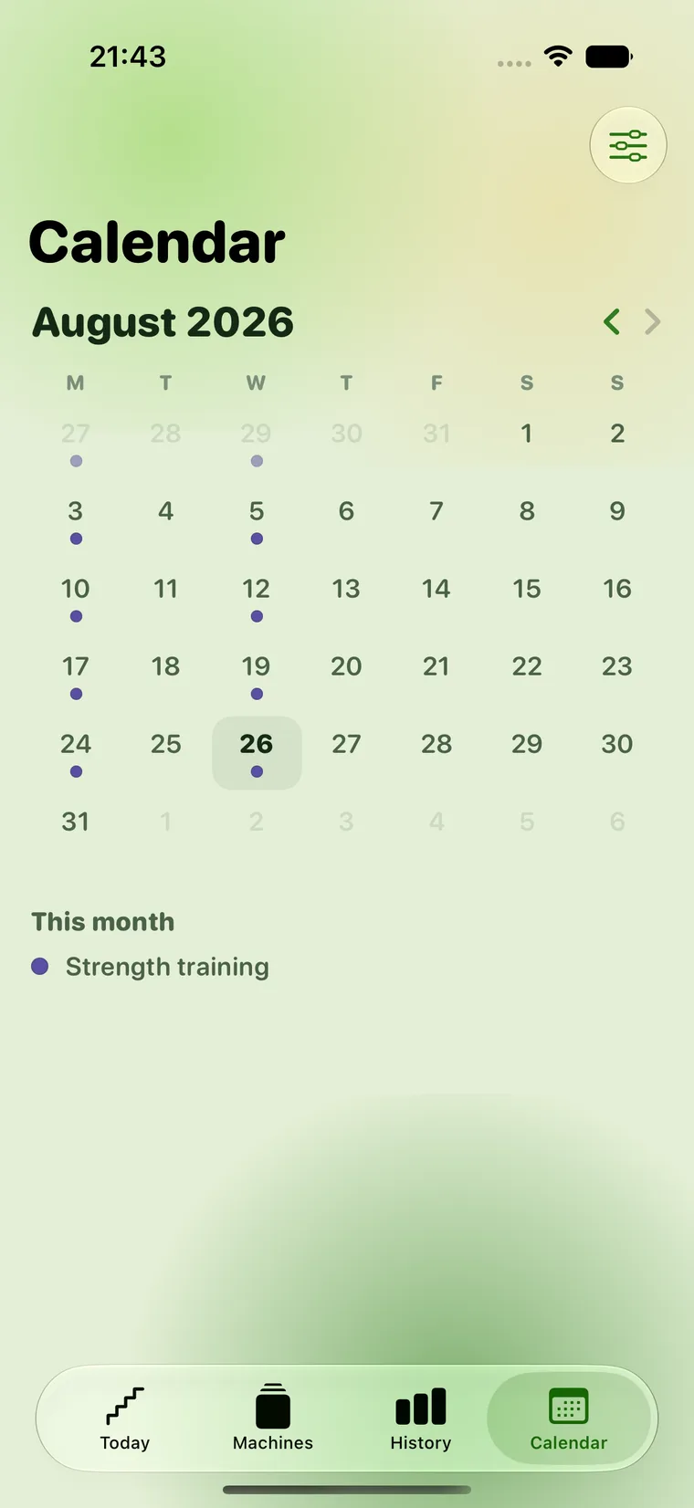 The training calendar: a month grid starting on Monday, with small coloured dots under individual days for strength and cardio. Empty days carry only their number.